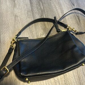 Coach Shay Pebbled Leather shoulder bag with crossbody strap.